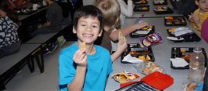 Crooked Lake Elementary student eating lunch 